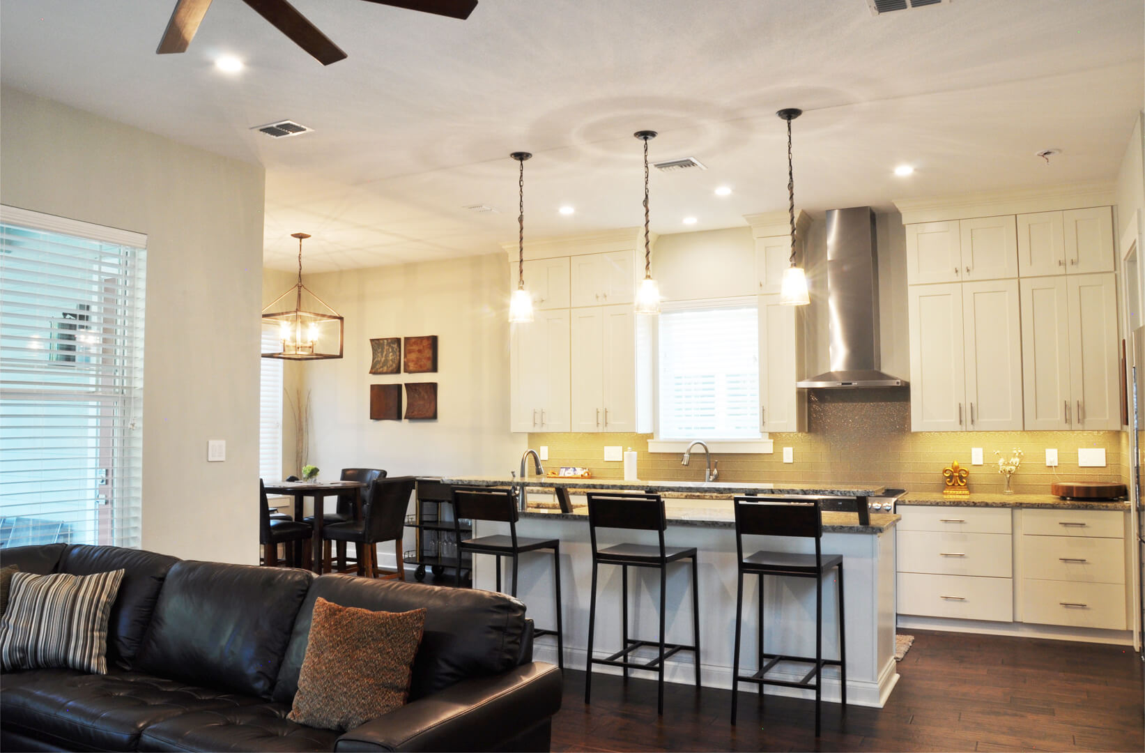 Theriot residence completed kitchen with barstools and pendant lighting