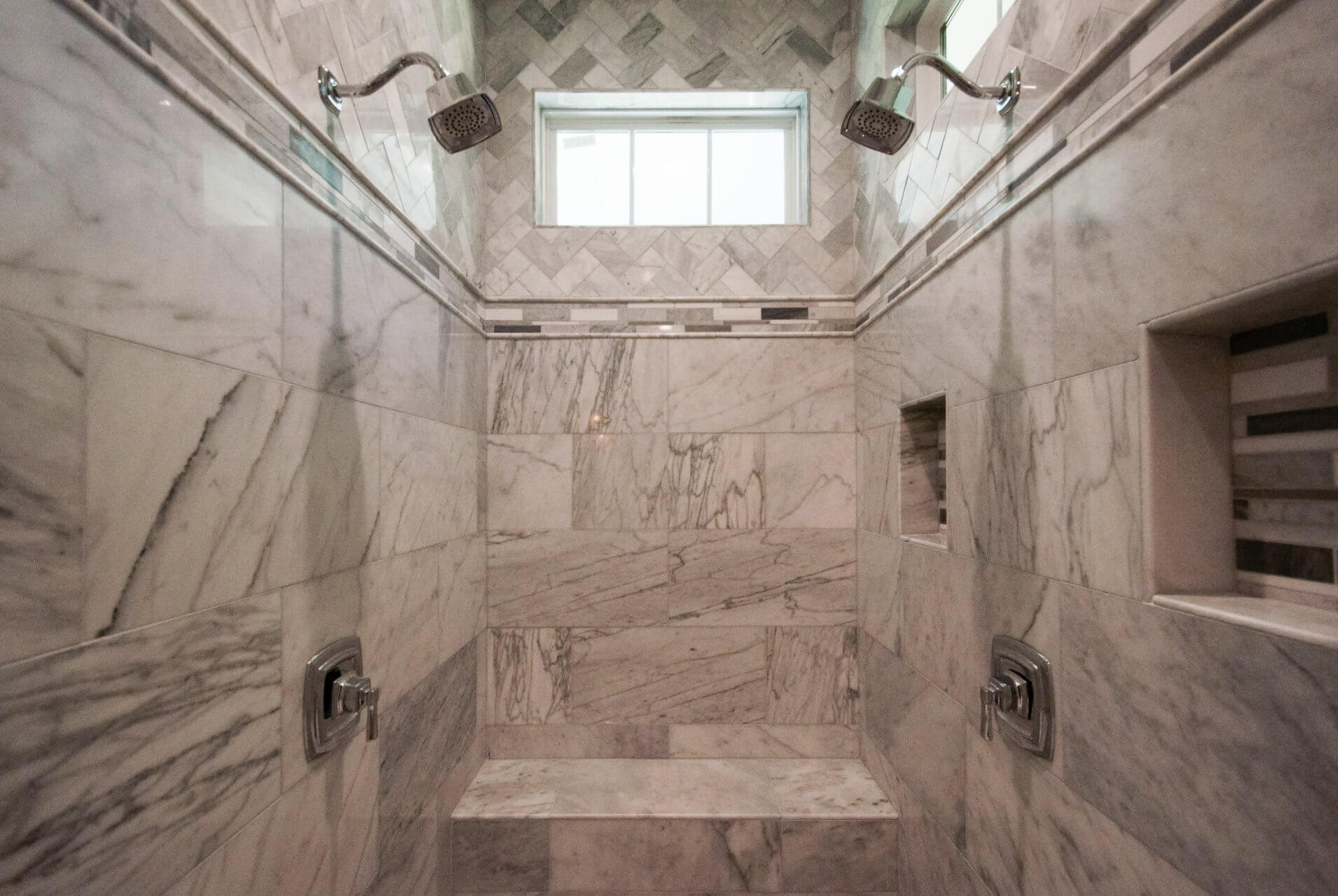 Detail of tile work in master bath shower in Shotgun Cottage on Lloyd Street in East Hill