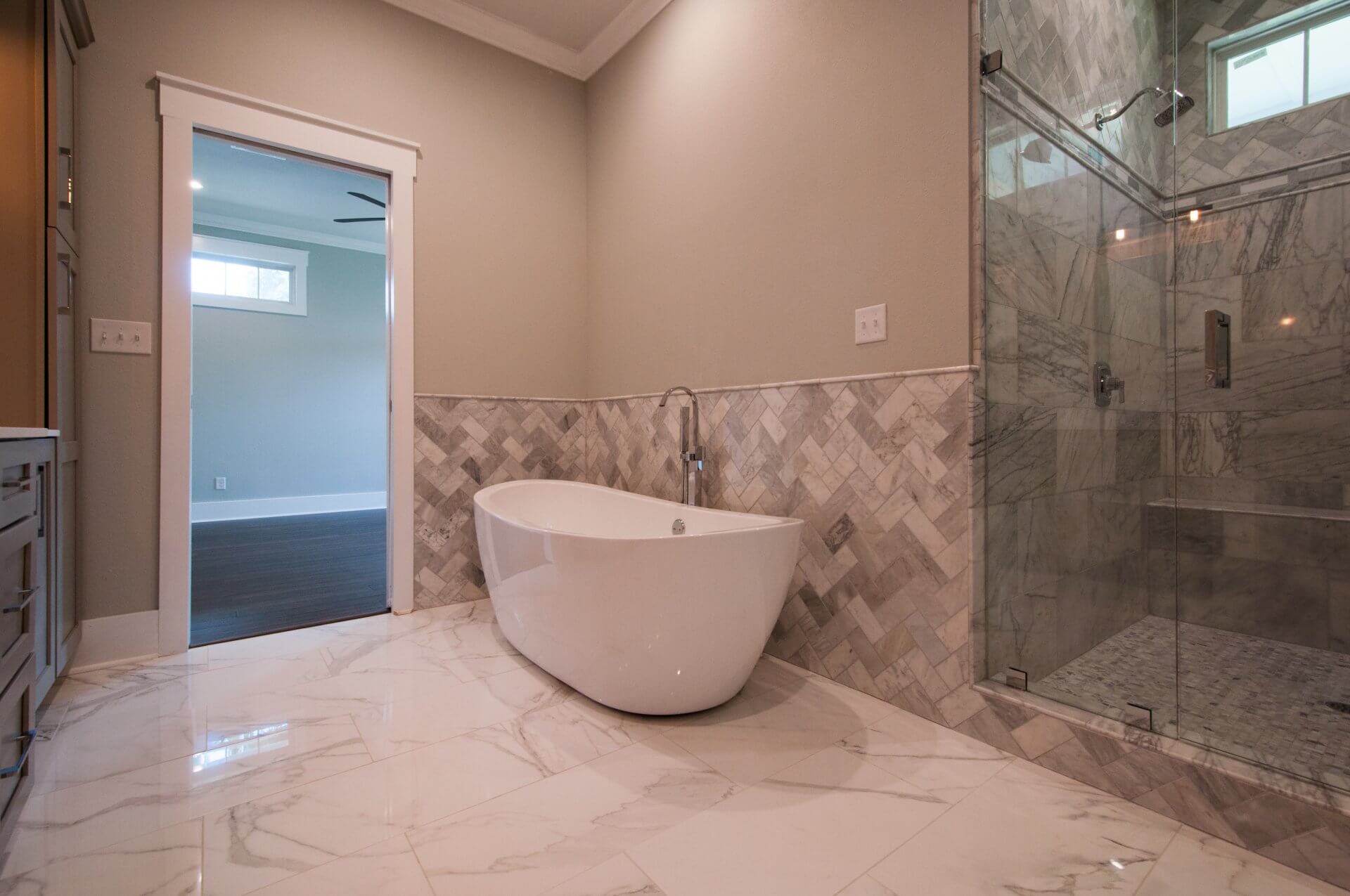 Master bathroom tub and shower in Shotgun Cottage on Lloyd Street in East Hill