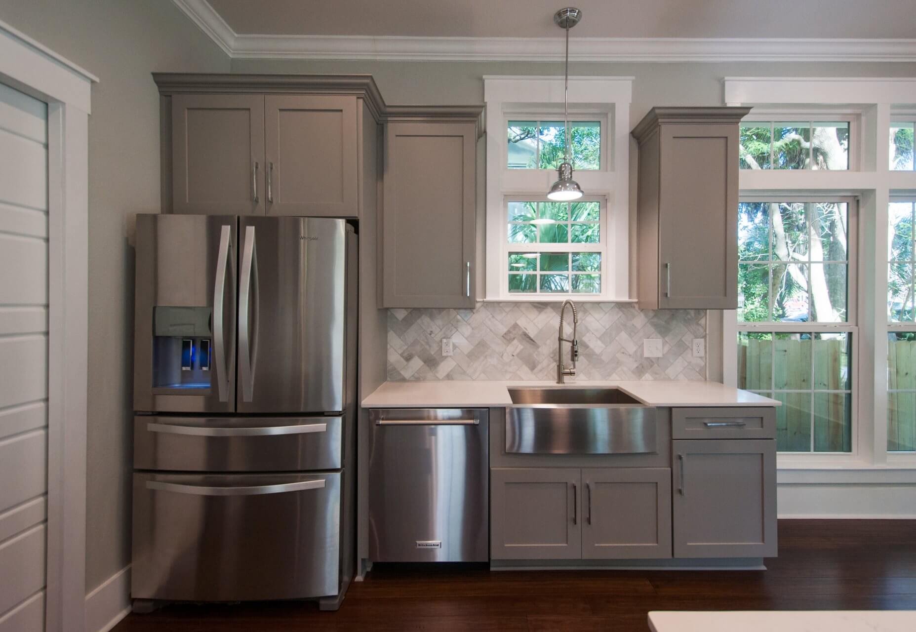 Stainless steel appliances and sink in kitchen of Shotgun Cottage on Lloyd Street in East Hill